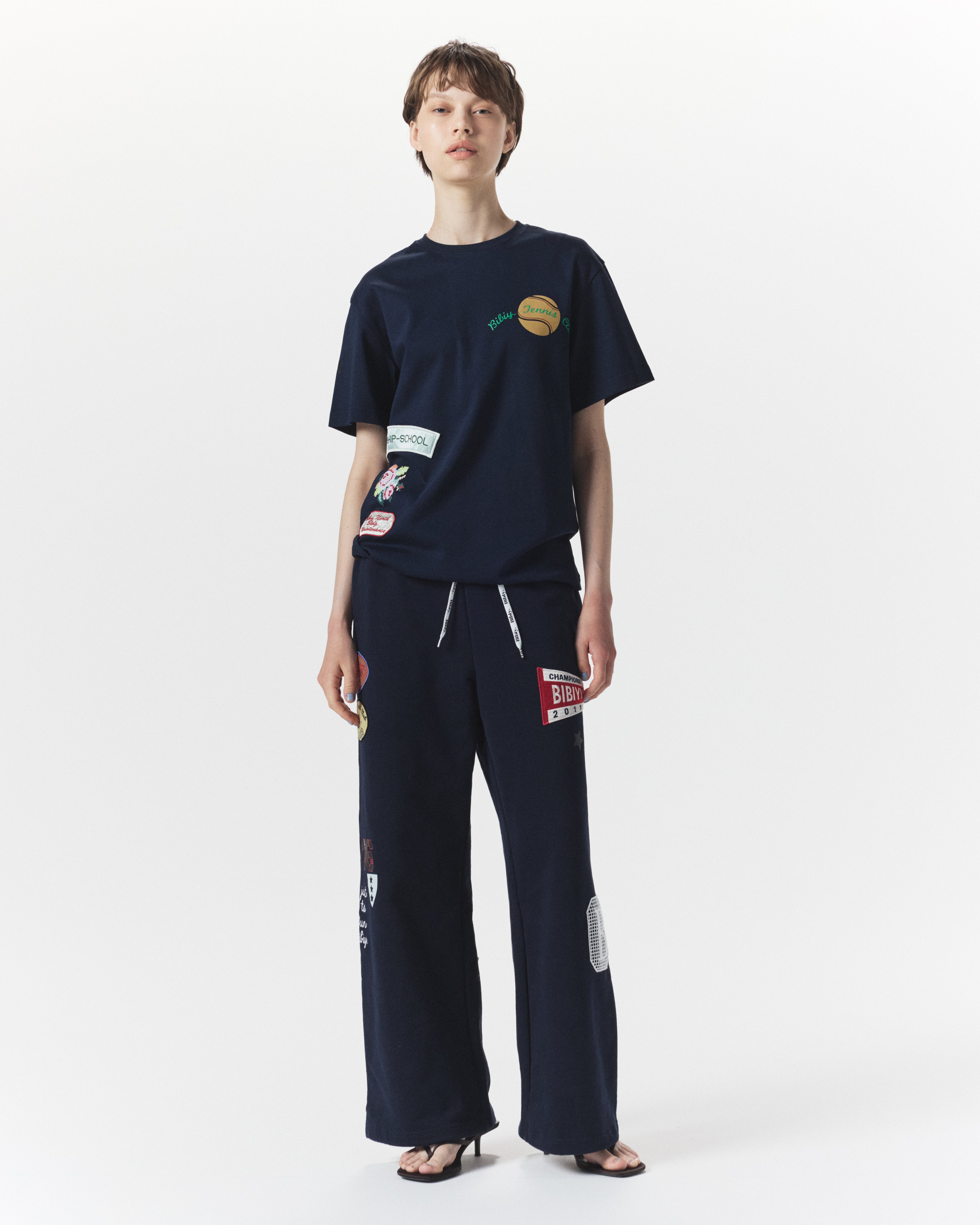 B. TENNIS CLUB SWEATPANTS